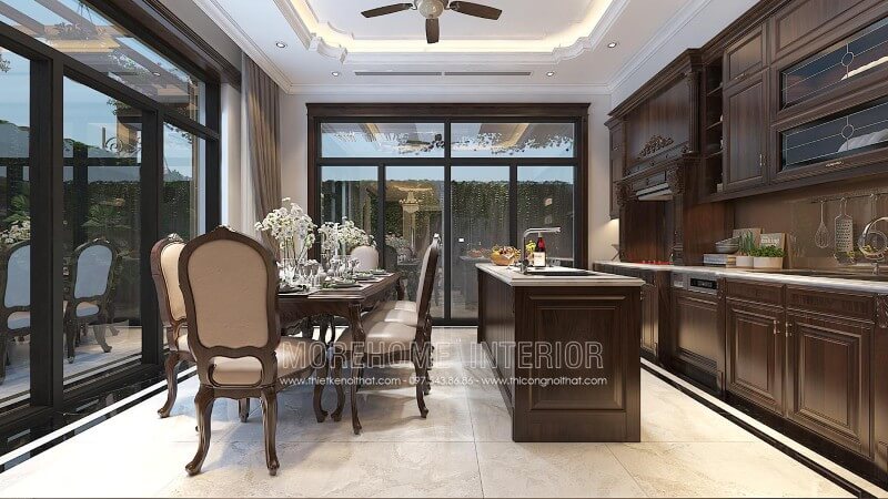Mẫu tủ bếp tân cổ điển có đảo bếp được bố trí tại trung tâm phòng bếp tạo nên 1 khu nấu nướng riêng biệt, giúp việc công việc nấu nướng của chị em nội trợ trở nên thuận tiện hơn. Thiết kế tủ bếp đẹp
